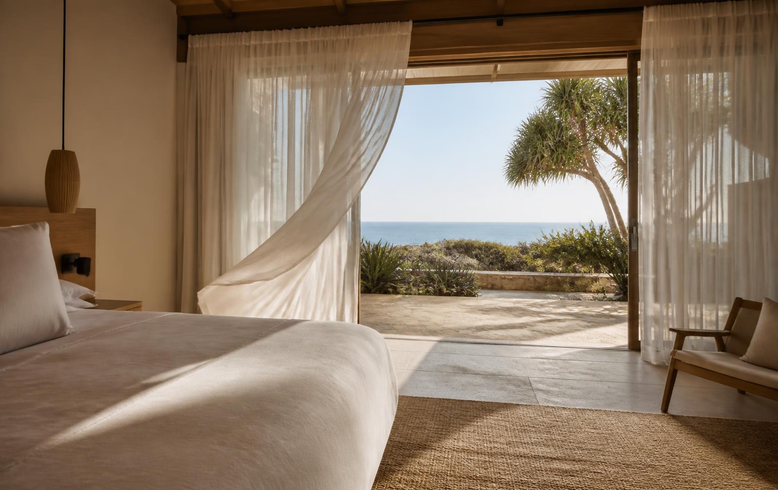 Resort guestroom window furnishings opening to a terrace